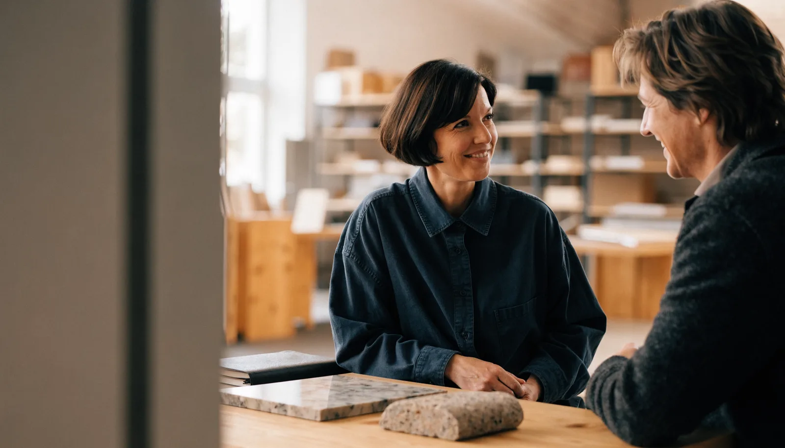 Illustrative scene of a smiling business owner having an unhurried conversation with a customer.